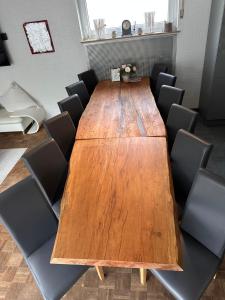 a conference room with a wooden table and chairs at Haus-36 in Neuss