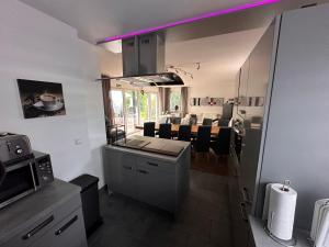 a kitchen and living room with a dining room at Haus-36 in Neuss