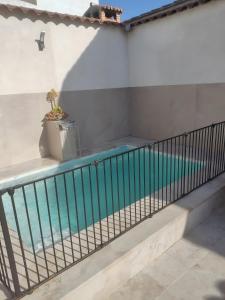 a balcony with a swimming pool in a house at La Jara Rosa in Los Navalucillos