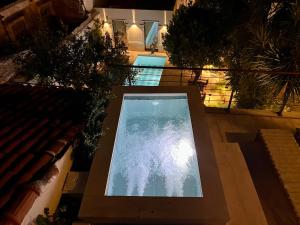 an overhead view of a swimming pool in a house at Thirty8 Heritage House in Chania