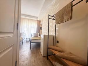 a room with a refrigerator and a bedroom at Köşk Boutique Hotel - Old Town & City Center in Antalya