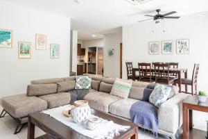 a living room with a couch and a table at Jaco Bay 1202 in Jacó