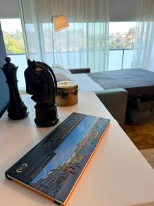 a book sitting on top of a table at Na Outra Margem - Douro River Views - Free Parking in Vila Nova de Gaia +12 photos