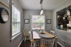 a dining room with a table and chairs at True Bed - and Breakfast! - made fresh by Grandma in Frankenmuth