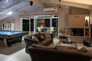 a living room with a pool table at Gela in Livadeia