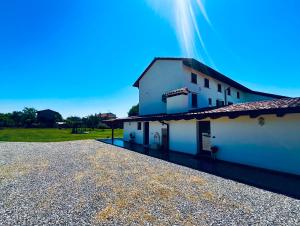 a white building with a rainbow in the sky at Casale Sol Armonie in Codroipo
