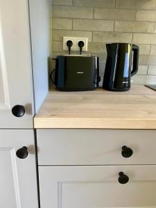 a coffee maker sitting on top of a counter at Ferienhaus Lykkehus Dümmer See in Hüde +22 photos