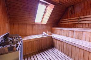 an inside view of a wooden sauna with a window at Wyndham Puerto Varas Pettra in Puerto Varas