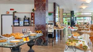 a bakery with a variety of food on display at Hotel Brig in Cattolica