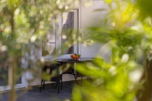a table in front of a mirror on a patio at Studio apartman Lea in Baška