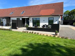 a house with a red roof and a green yard at 3 km to Legoland in Billund