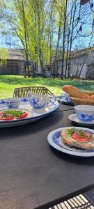 a table with plates of food on top of it at Józefowa Chata in Rudnik