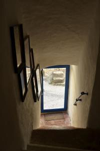 a stairway leading to a door with a window at Gîte 'An Kay Ou' - L'Aiglette in Pontaix