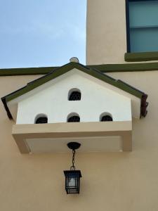 a bird house on the side of a building at Hotel casa el Palomar -5 in San Baltasar +1 photo