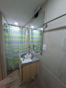 a bathroom with a sink and a mirror at Hotel casa el Palomar -5 in San Baltasar