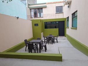 a courtyard with tables and chairs in a building at Hotel casa el Palomar -5 in San Baltasar