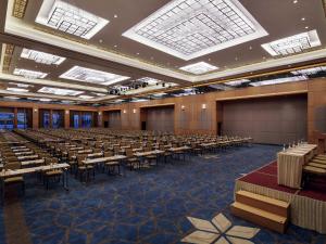 a large room with rows of tables and chairs at Movenpick Hotel Malatya in Malatya +80 photos