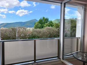 a room with a window with a view of mountains at ALEKSANDAR - luxury stay private guest rooms in Gotse Delchev