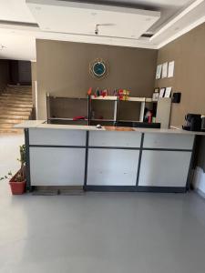 an empty office with a counter in a room at Residencial Convênios- Hotelaria e Turismo LDA in Luanda +42 photos