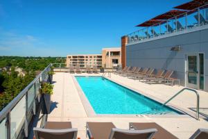 a swimming pool on the side of a building at Spacious Apartment w Rooftop Views in Arlington