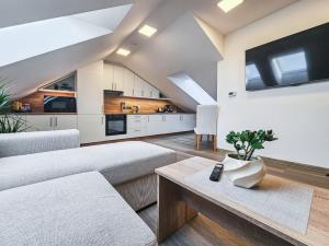 a living room with a couch and a table at Aparthotel Svitavy in Svitavy