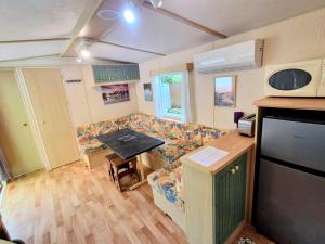 a living room with a couch and a table at Evasion Charente in Sémussac