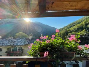 a window with a view of a mountain at Sotto il Cielo, Balcone panoramico sul borgo di Ingria in Ingria