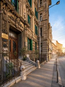 an old building on a street in a city at Center Vibes Lux in Rijeka