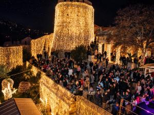a large crowd of people standing on the stairs at night at Center Vibes Lux in Rijeka