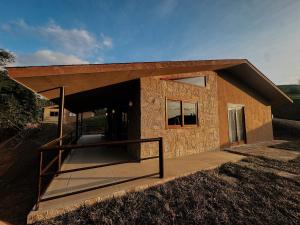 a small house with a roof on a hill at Villa Arouca in Areal