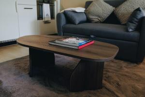 a wooden coffee table with books on it in a living room at Apartment in Engelberg in Engelberg