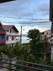 a view of the ocean from a street with buildings at Green House in Pogradec