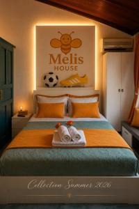 a bedroom with a bed with towels on it at Melis House - Lake View, 75'' TV Live Football, Free Parking in Ioannina