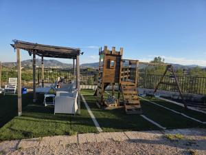 a playground with a ladder and a swing at Casa Rural Natur Libre in Alicante