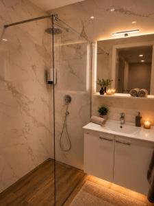a bathroom with a shower and a sink at Romantic Sunset Retread I 4 Min to A2 I E-Bikes I Near Ljubljana in Velika Loka