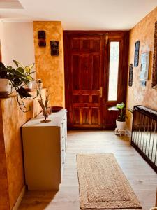 a room with a door and a table with a rug at Villa Alexandra 1 in Imárcoain