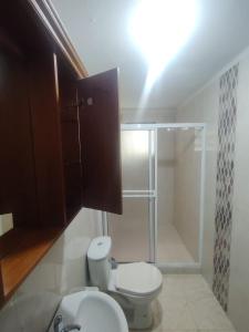 a bathroom with a toilet and a shower at El Renacer in San Gil +76 photos