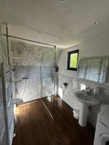 a bathroom with a shower and a sink at Vikendica Mia in Šipovo +47 photos