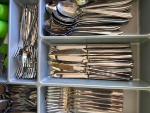 a drawer full of utensils and forks and spoons at Appartment im Villenviertel in Jena