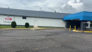 an empty parking lot in front of a gas station at SPRINGWOOD HOTEL, Opelika I-85 Columbus Pkwy in Opelika