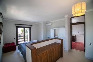 a bedroom with a bed and a large mirror at Villa Stone Bodrum - Private Pool & Garden in Bodrum City +24 photos
