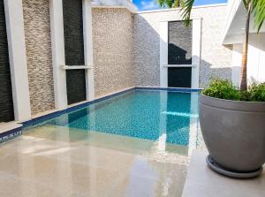 a swimming pool in the middle of a house at Luxury Suite with Pool in Melgar in Melgar