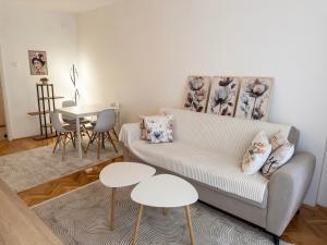 a living room with a couch and two tables at Angel's Residence in Veles