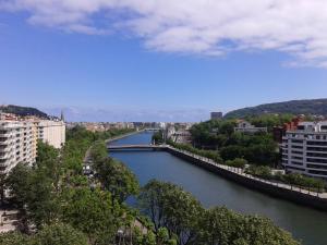 
a large body of water with a bridge over it at Hotel Silken Amara Plaza in San Sebastián
