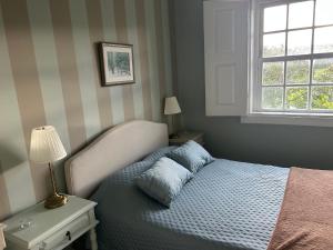 a bedroom with a bed and a window at Casa da Ponte in Baião +73 photos