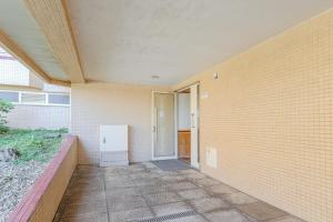 an empty hallway of a building with a door at Ocean View Luxury Duplex Apartment in Ovar