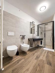 a bathroom with a toilet and a sink at Casa Guerines in Tremosine Sul Garda
