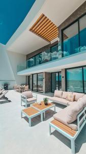 a living room with two couches and a table at Villa Aurora Luxury Villa with Infinity Pool in Portimão