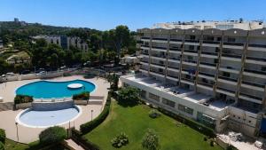 an aerial view of a building with a swimming pool at Salou Beach Apartment with private Pool in Salou