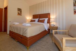 a bedroom with a large bed and a couch at B&B Villa Marta - New Opening 2026 in Medulin +101 photos